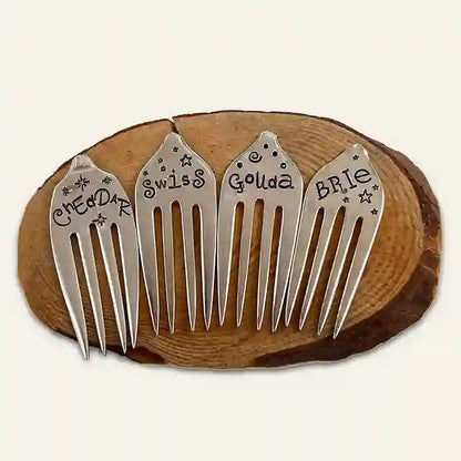 Gouda, cheddar, brie, and swiss silverware fork cheese markers on wood coaster
