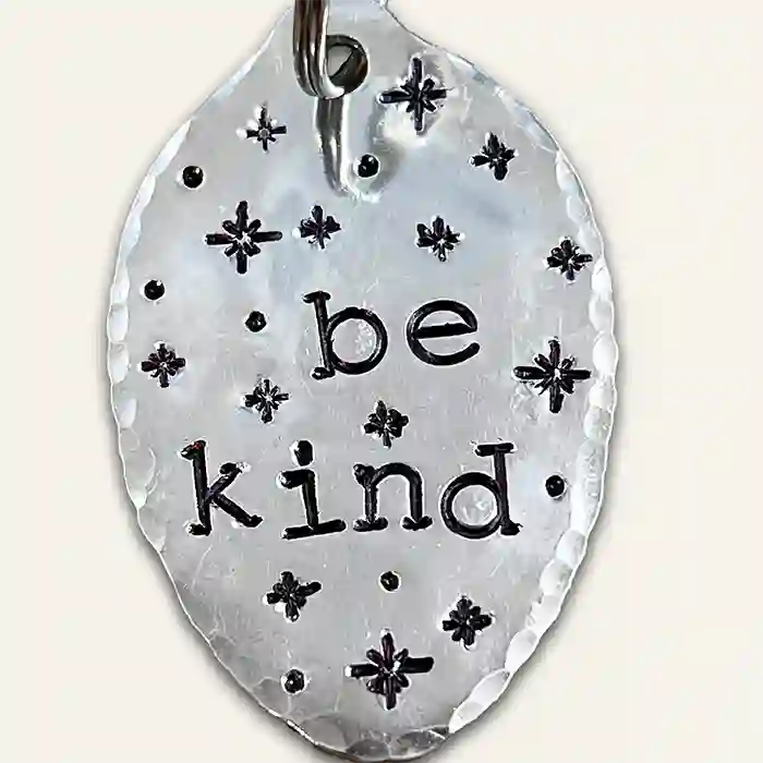 Vintage silver-plate spoon keychain with the text 'Be Kind' hand stamped on it