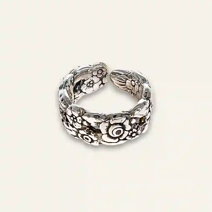 Boho-style floral spoon ring with hand-shaped band