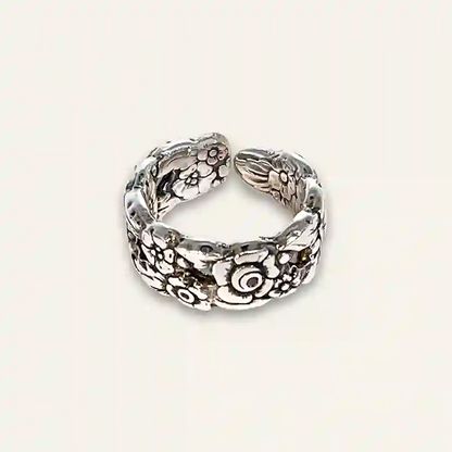 Boho-style floral spoon ring with hand-shaped band