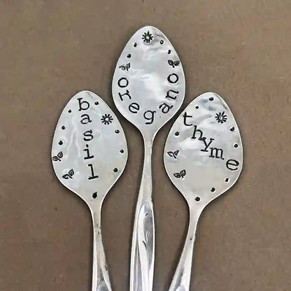 Vintage silver-plate flattened spoon herb marker set of 3 Basil, Oregano, and Thyme on dark background
