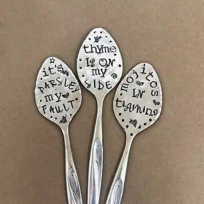 Vintage silver-plate flattened spoon herb marker set of 3 on dark background