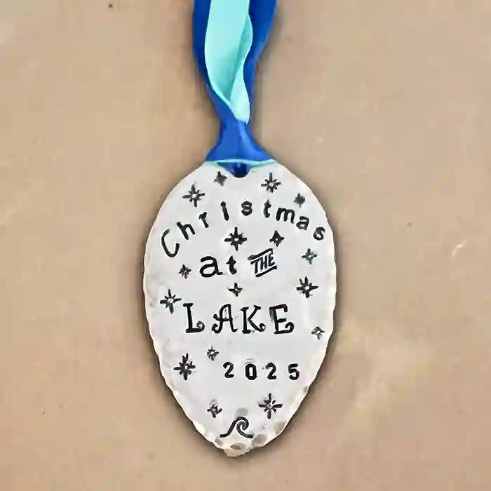 Christmas At The Lake 2025 vintage silver-plate silverware spoon ornament on tan background