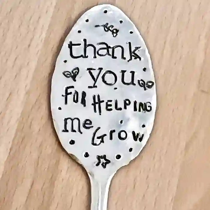 Thank You For Helping Me Grow silver-plate vintage spoon garden marker on light wood background