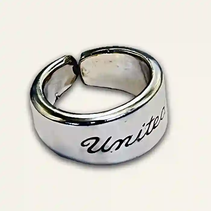 United Airlines vintage spoon ring front view on neutral background