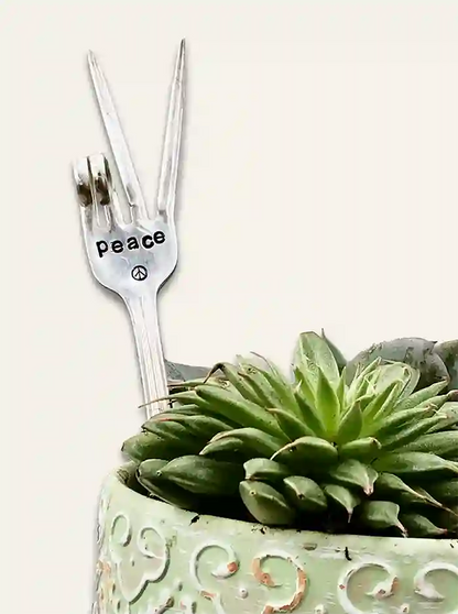 PEACE fork garden marker made from vintage silver-plate silverware , two-finger peace sign, stuck in plant