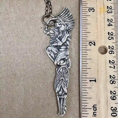 Silver-plate pendant of a stylized Native American figure made from a vintage souvenir spoon handle measuring nearly 4 inches