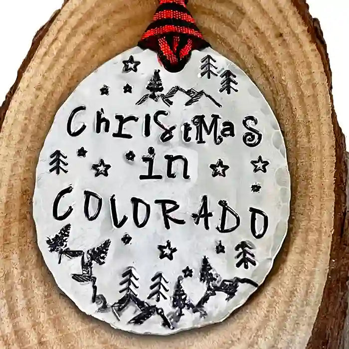 Christmas in Colorado stamped on a vintage silver-plate spoon ornament.
