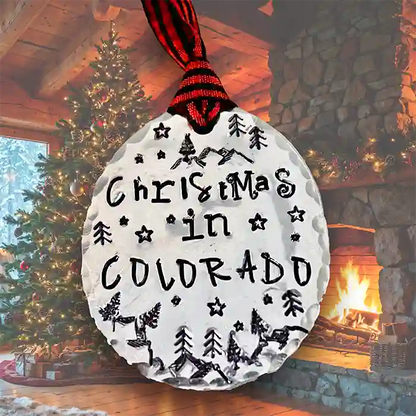 Christmas in Colorado on a vintage silver-plate spoon ornament with festive background