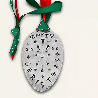 Vintage silver-plate slotted serving spoon with 2025 Christmas stamped on it