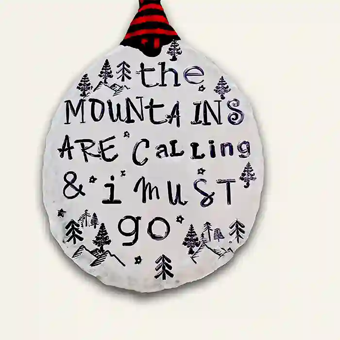 The Mountains Are Calling & I Must Go stamped into round vintage spoon making beautiful ornament