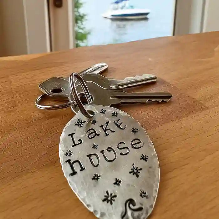 Lake House Silver-plate vintage spoon keychain with keys laying on table