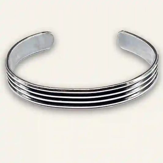 Sterling Silver bangle bracelet with three bands on a white background