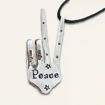 Peace Ornament (two-finger peace sign) made from vintage silver-plate fork